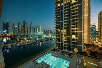 a view of a city with a river and buildings at Seaside Stay at Beach Mansion with Private Beach in Dubai