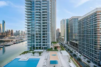 an aerial view of a city with tall buildings at Seaside Stay at Beach Mansion with Private Beach in Dubai