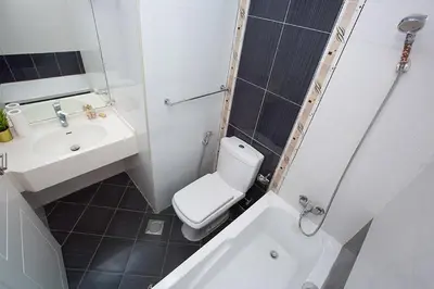 a bathroom with a white toilet and a sink at 2 Bedroom Apartment JBR Skyline with Balcony in Dubai