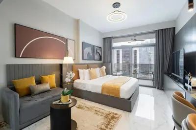 a bedroom with a king sized bed and a couch at Vogue Downtown Mag 318 near Burj Khalifa and Dubai Mall, Studio Apartment with Balcony, Pool and City View, Access to all Amenities in Dubai