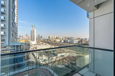 a view of a city from the balcony of a building at Luxury 1 Bed Retreat with Balcony in JVT in Dubai