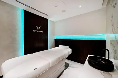 a room with a white couch and a black sink at Luxury 1BR Duplex on the Canal Business Bay in Dubai