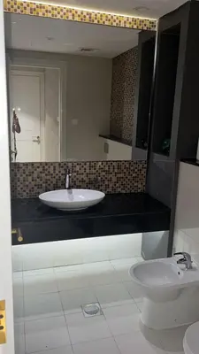 a bathroom with a sink and a mirror and a toilet at Damac Upper Crest 2BR Dubai Mall Near 5 min walk in Dubai