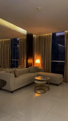 a living room with a couch and a table at Damac Upper Crest 2BR Dubai Mall Near 5 min walk in Dubai