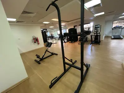 a gym with two exercise bikes in a room at Mavies Estate Al Jaddaf by Marriot in Dubai
