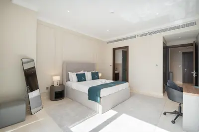 a bedroom with a bed and a television in it at Balcony with City View 2 Bedroom - JLT Dubai Close to Metro & Marina by Heaven Crest Vacation Homes in Dubai