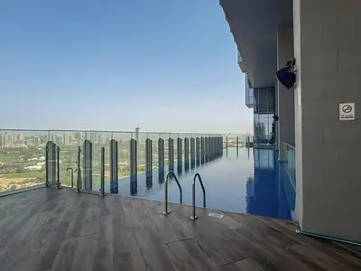 a view from a building with a pool of water at Balcony with City View 2 Bedroom - JLT Dubai Close to Metro & Marina by Heaven Crest Vacation Homes in Dubai