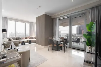 a living room with a couch and a table at Balcony with City View 2 Bedroom - JLT Dubai Close to Metro & Marina by Heaven Crest Vacation Homes in Dubai