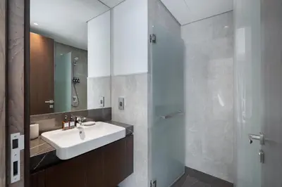 a bathroom with a sink and a shower at Balcony with City View 2 Bedroom - JLT Dubai Close to Metro & Marina by Heaven Crest Vacation Homes in Dubai