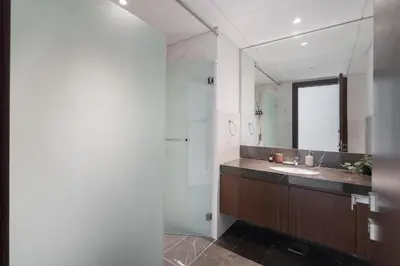a bathroom with a sink and a mirror at Balcony with City View 2 Bedroom - JLT Dubai Close to Metro & Marina by Heaven Crest Vacation Homes in Dubai