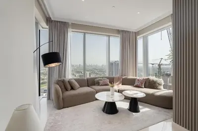 a living room with a couch and a table at Balcony with City View 2 Bedroom - JLT Dubai Close to Metro & Marina by Heaven Crest Vacation Homes in Dubai