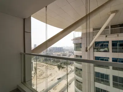 an office building with a view of a city at Opalz Grandeur Escape 2BDR w Mini Pool-06 in Dubai