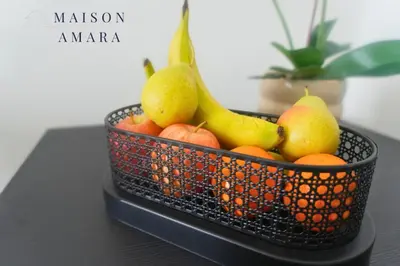 a basket of fruit sitting on a table at Modern Luxury Studio Damac Hills With Golf View in Dubai