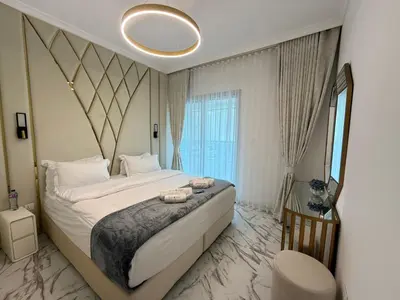a bedroom with a large bed and a large window at Luxury 1BDR in the heart of Marina Walk to Metro & Promenade #11 in Dubai