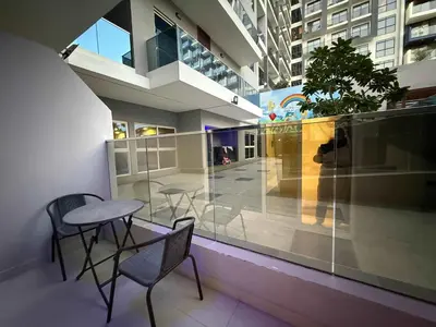 a balcony with a table and chairs in a building at Chic Studio in Dar Al Jawhara Residence in Dubai