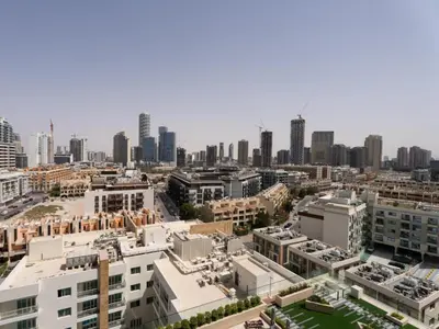 an aerial view of a city with tall buildings at Aesthetic Elegance 1BDR in Binghatti Onyx in Dubai