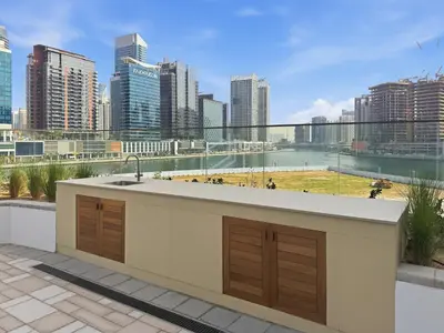 a kitchen with a sink and a view of a city at 2BD Stylish Apartment with Amazing Canal Views in Dubai