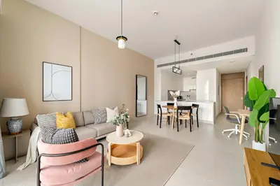 a living room with a couch and a table at Silkhaus Elite 3BR near Dubai Watercanal in Al Wasl in Dubai