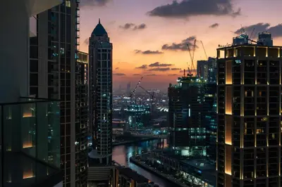 a view of a city skyline at night at GuestReady - 1BR l Burj Khalifa View in Dubai
