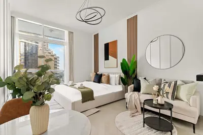 a living room with a bed and a couch at Silkhaus Studio Stay in Dubai Marina - Botanica in Dubai