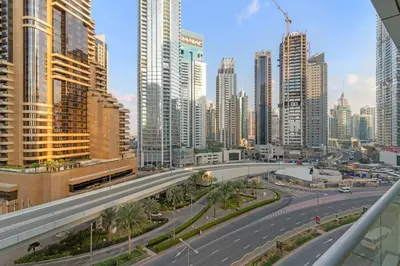 a highway in a city with tall buildings at Silkhaus Studio Stay in Dubai Marina - Botanica in Dubai