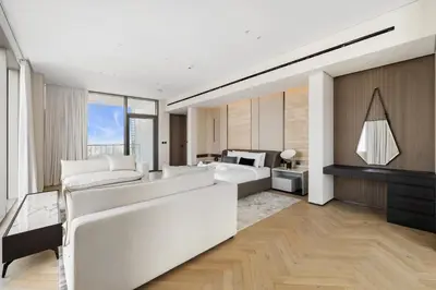 a bedroom with a bed and a living room at LIV Marina, Dubai Marina - 4 Bedroom Penthouse with Panoramic Views - Allsopp & Allsopp in Dubai