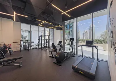 a gym with a view of a city skyline at LIV Marina, Dubai Marina - 4 Bedroom Penthouse with Panoramic Views - Allsopp & Allsopp in Dubai