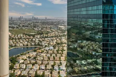 an aerial view of a city with a skyscraper at Scenic Lakeview Stay Stylish 1 Bedroom in JLT in Dubai