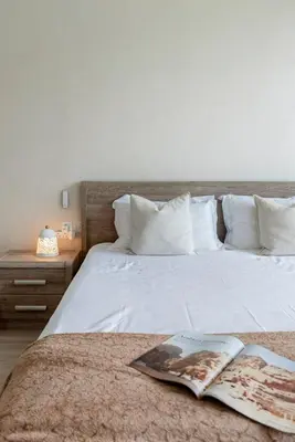 a bedroom with a bed with a book on it at Scenic Lakeview Stay Stylish 1 Bedroom in JLT in Dubai