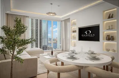 a living room with a white table and chairs at Daniels 2BR at Creek Gate with Canal View in Dubai