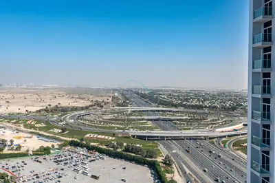 an aerial view of a highway with a parking lot at Peaceful High-Rise Studio Overlooking Miracle Garden, Skyz by Danube, Arjan by Deluxe Holiday Homes in Dubai