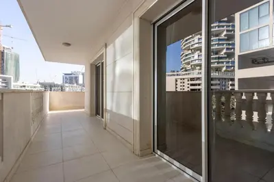 a balcony with a view of a building at Contemporary 2BR in JVC With Pool, Gym & Relaxing Stay in Dubai