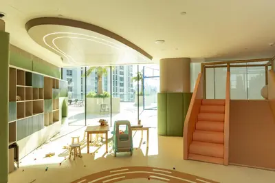 an office with a hallway with a table and chairs at Spacious and Cozy Apartment - Binghatti Phantom 2404 in Dubai