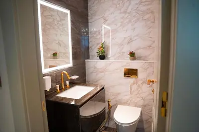 a bathroom with a sink and a toilet at Italian-Design 2BR l Large Private Terrace l Ground Floor in Dubai