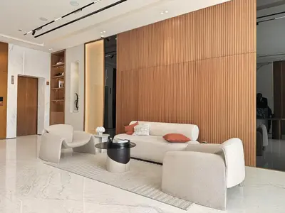 a living room with a couch and two chairs and a table at Elegant and Stylish Retreat - Lavender Binghatti 1103 in Dubai