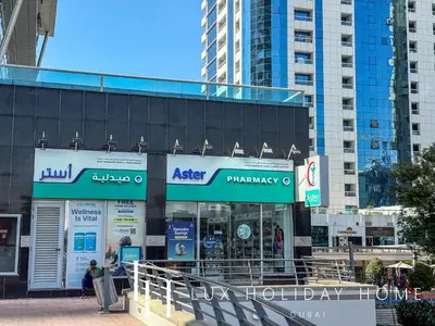 a store in a city with tall buildings at LUX The Armada Suite JLT in Dubai