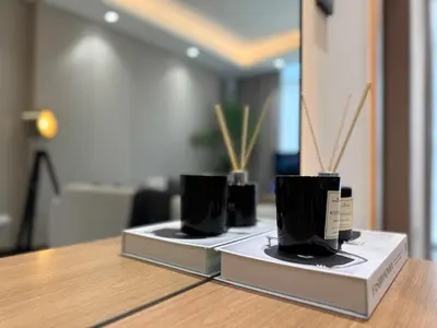 a row of black cups sitting on top of a table at Stylish 1 BR in Cloud Tower in Dubai