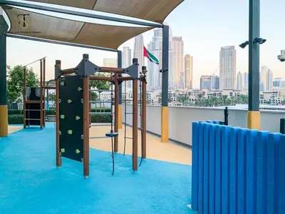 a gym with a climbing frame on the roof of a building at Dream Apartment with Burj Khalifa & Fountain Views in Dubai