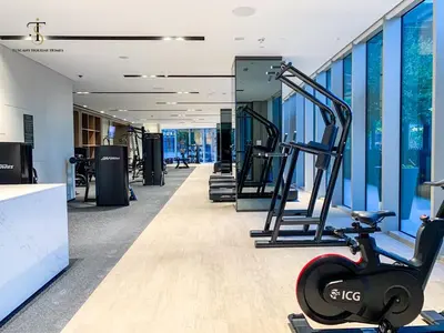 a gym with treadmills and a exercise bike at Dream Apartment with Burj Khalifa & Fountain Views in Dubai