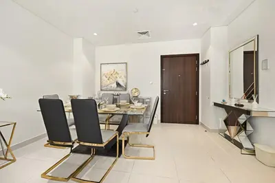 a dining room with a table and chairs at Bloomfields Tranquil 2BR in Dania 4 in Dubai