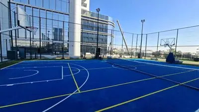 a tennis court in front of a building at Cloud Tower 1br With Parking Pool Gym & Sports Facilities in Dubai