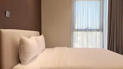 a bedroom with a white bed with a window at Cloud Tower 1br With Parking Pool Gym & Sports Facilities in Dubai