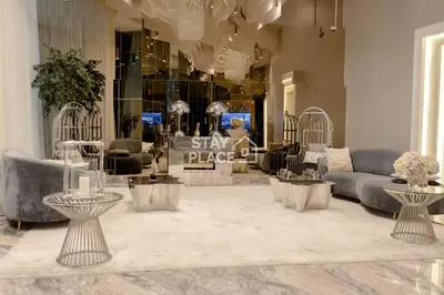 a living room with couches and tables in a store at FENDI 2BR- 67 Floor Sea, Atlantis & Dubai Eye View in Dubai