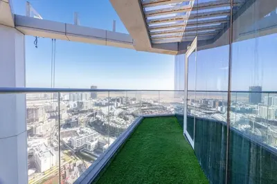 a view from the top of a building with a large window at Miracle View in Dubai