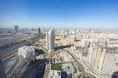 an aerial view of a city with tall buildings at Miracle View in Dubai