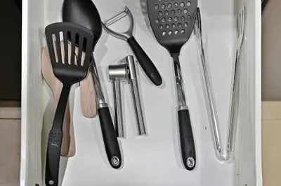 a drawer filled with spatulas and other kitchen utensils at Bloomfields Homey 1BR in Al Ramth 37 in Dubai