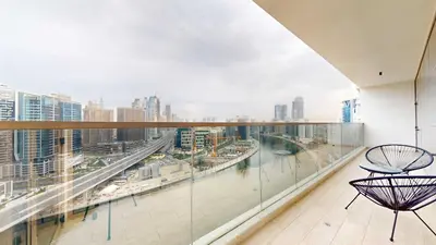 a balcony with a view of a city at Modern 3BR Full Canal & Burj Khalifa View 2 in Dubai