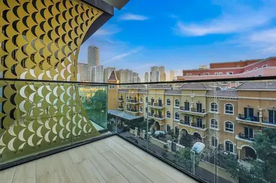 a balcony with a view of a city at Stunning 1 br modern luxury residence at JVC in Dubai