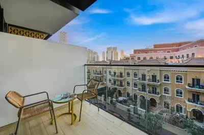 a balcony with a view of a building at Stunning 1 br modern luxury residence at JVC in Dubai