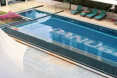 a swimming pool with the word miami on it at Stylish pool view 1BR in Barsha South sleeps 5 in Dubai